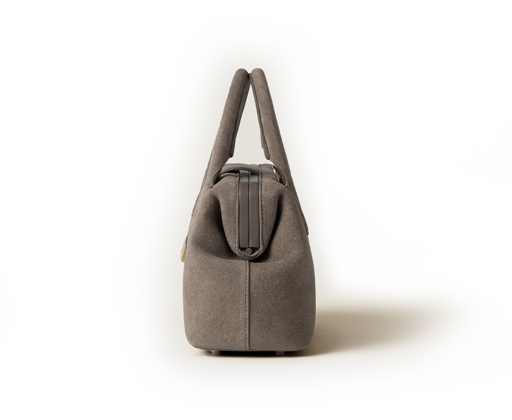 Side view of the Schell Doctor Bag Taupe Small in suede leather